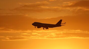 airplane under golden hour skies