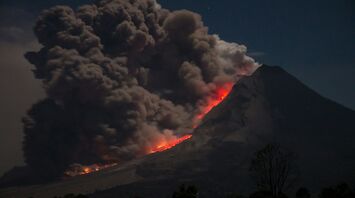 Mount erupting with ash clouds and lava flow
