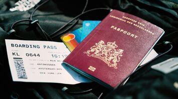 Boarding pass and passport in travel bag