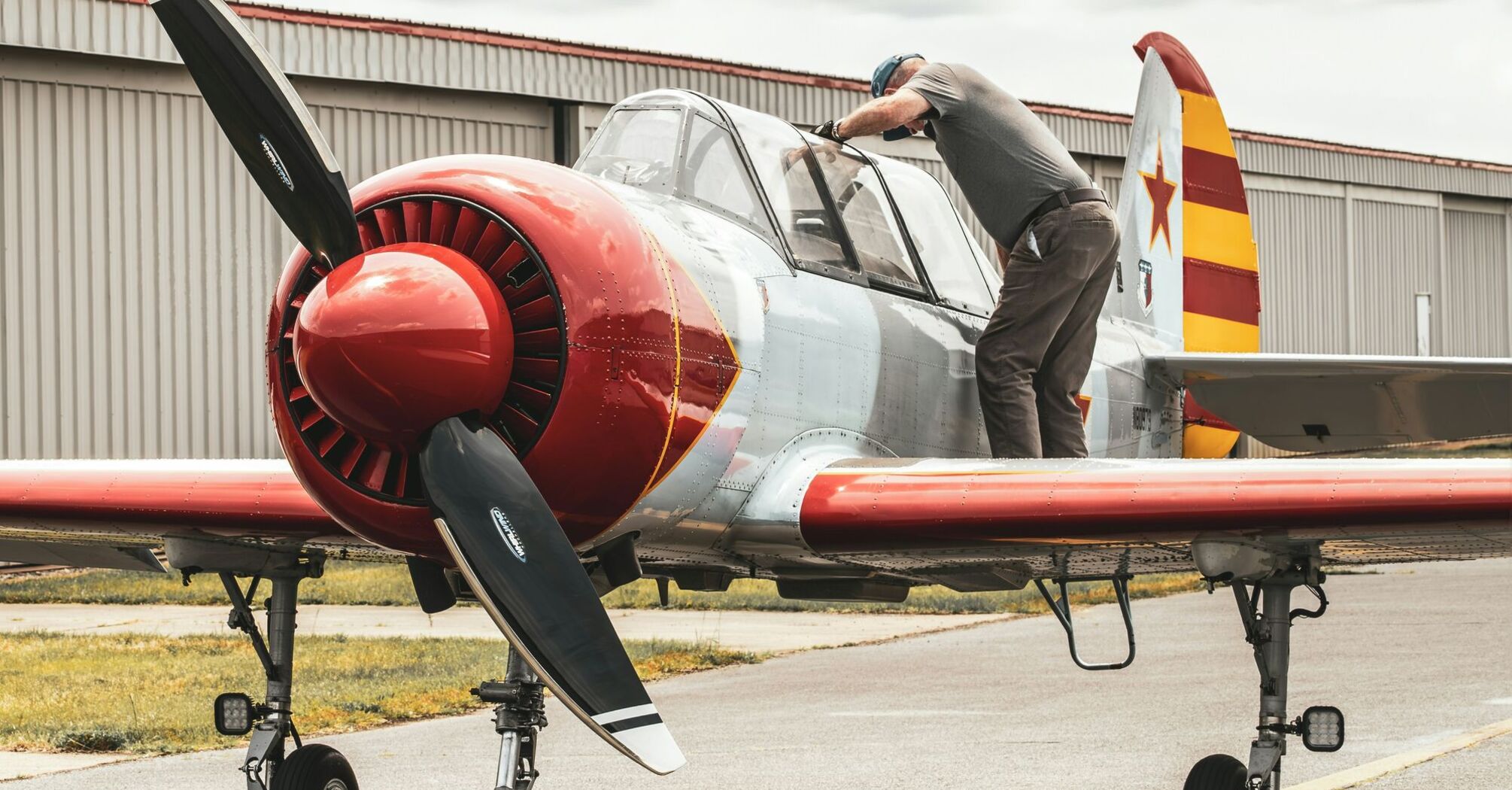 Soviet Yak-52 gets inspected by Hal Bowman, Bandit Flight Team