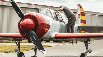 Soviet Yak-52 gets inspected by Hal Bowman, Bandit Flight Team