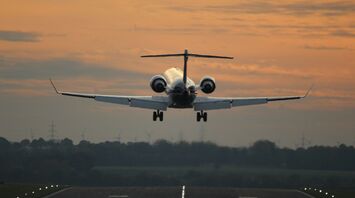 an Lufthansa airplane taking off from an airport runway