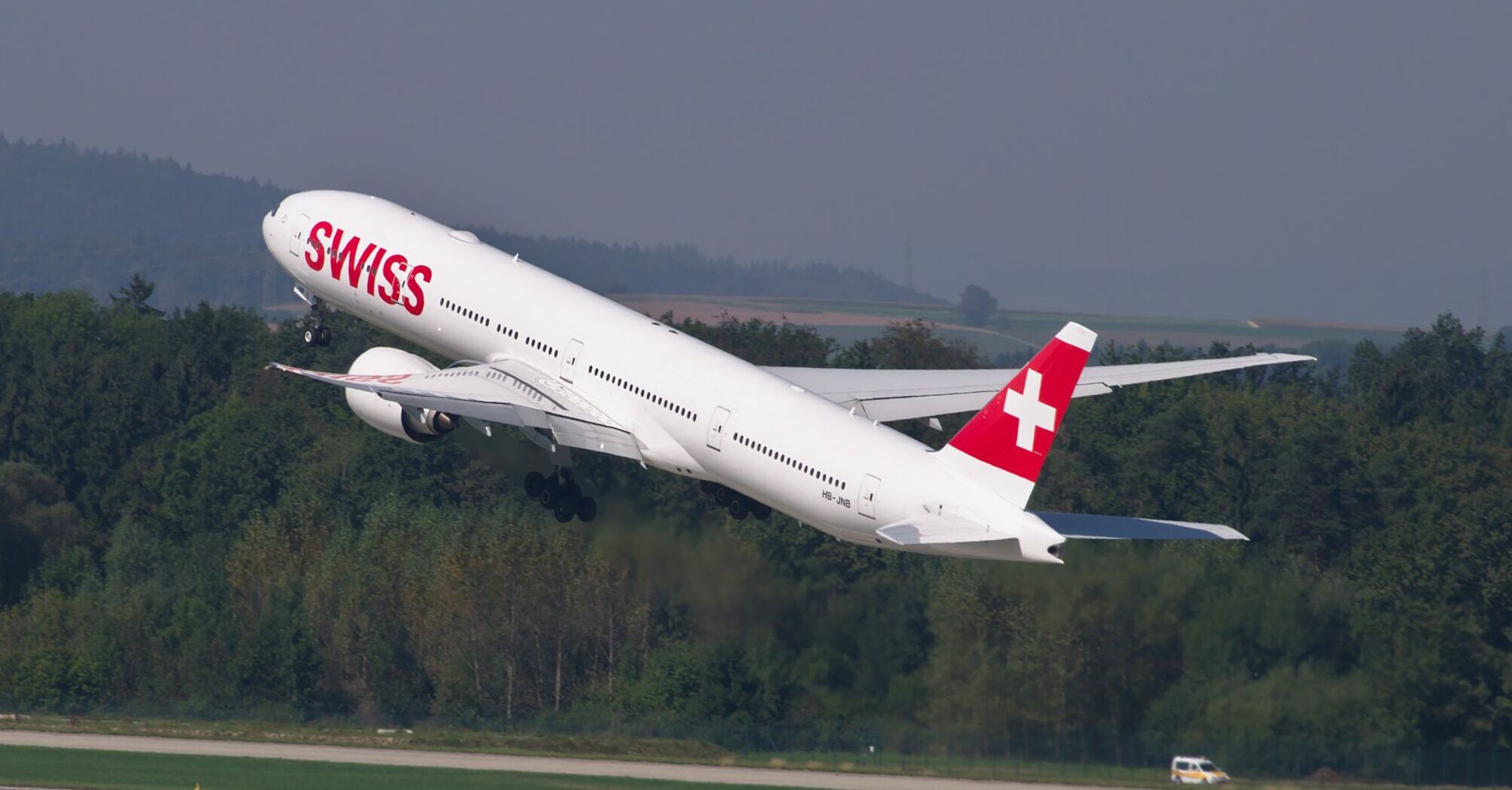 SWISS airplane taking off from the runway