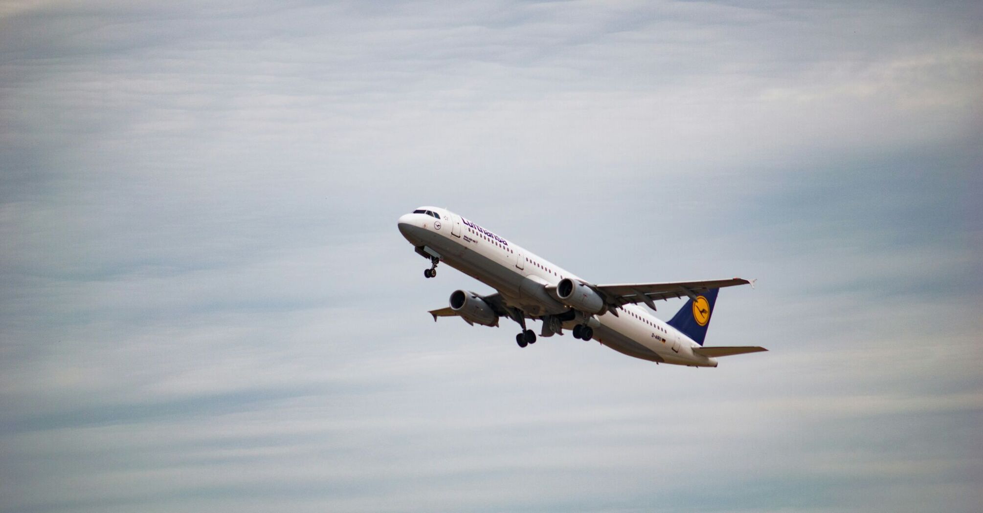 white Lufthansa airliner plane flying at sky