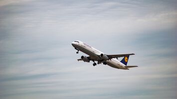 white Lufthansa airliner plane flying at sky