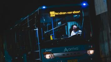 Arriva bus waiting at a station at night