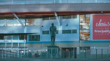 Principality Stadium entrance in Cardiff with a statue in front