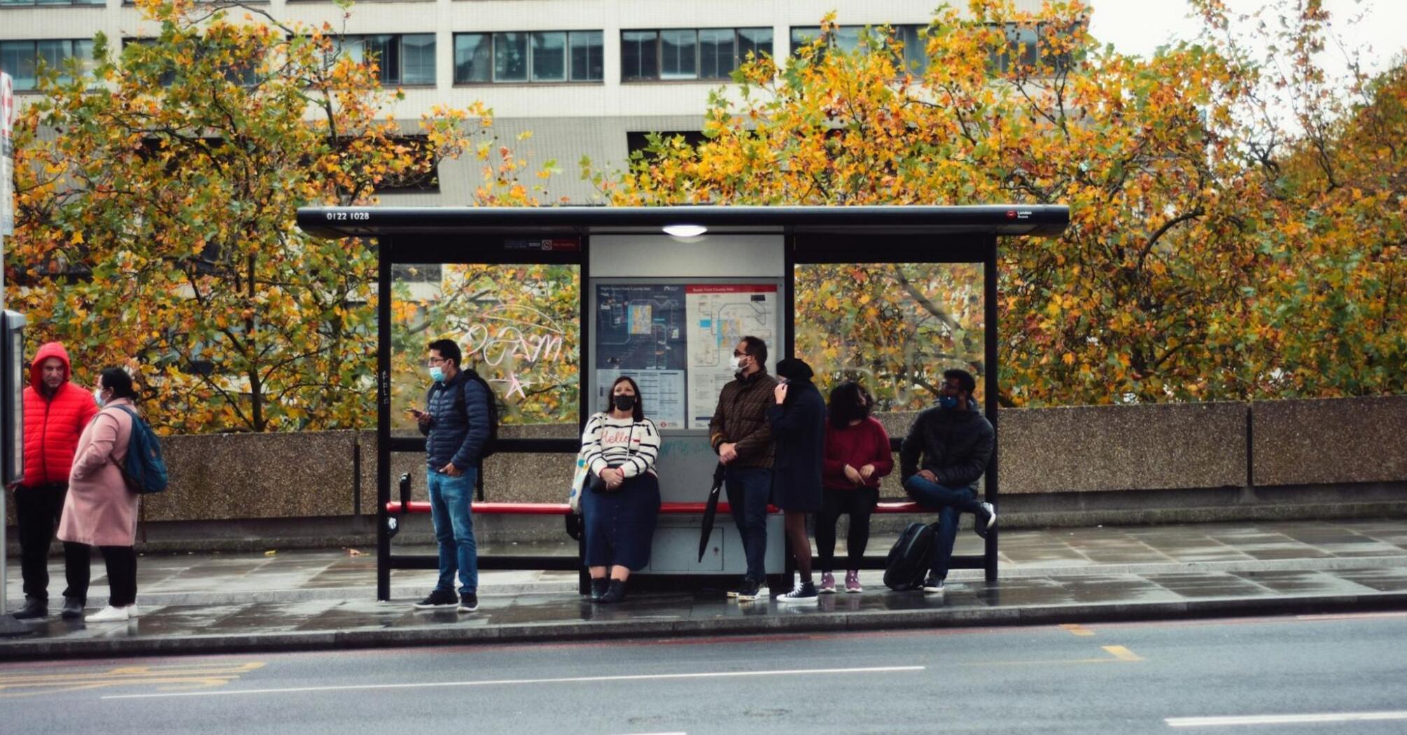 People waiting at a bus stop