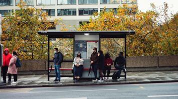 People waiting at a bus stop