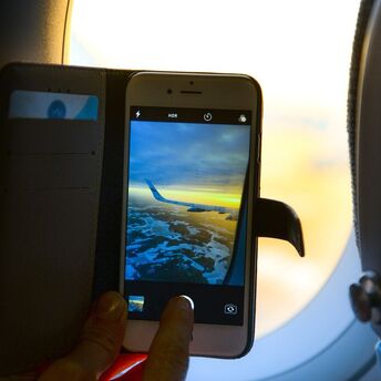 Can you use a cell phone on a plane: reasons for restrictions for cell phone owners and rules for a safe flight