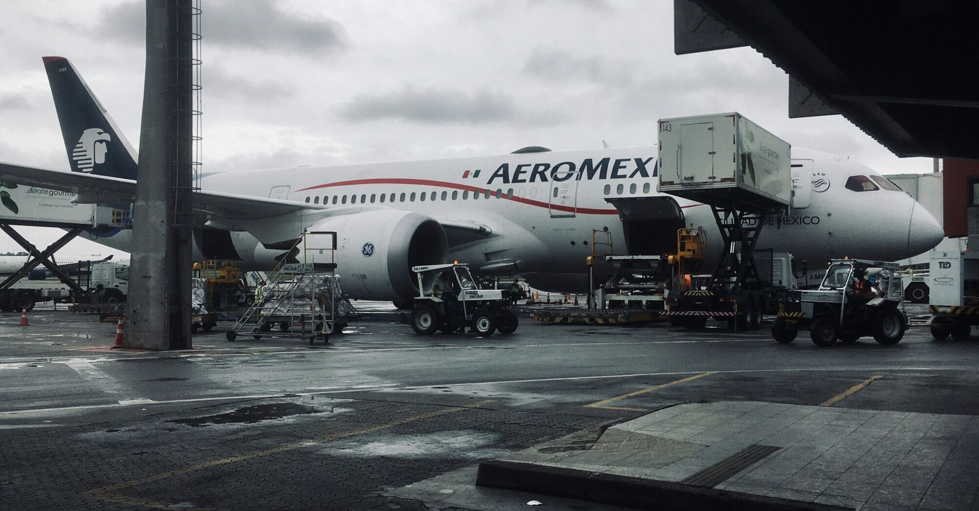 a large Aeromexico airplane is parked at an airport