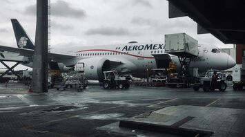 a large Aeromexico airplane is parked at an airport