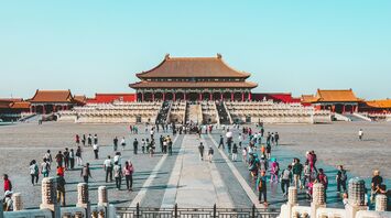 Tourists visiting a historic Forbidden City in China