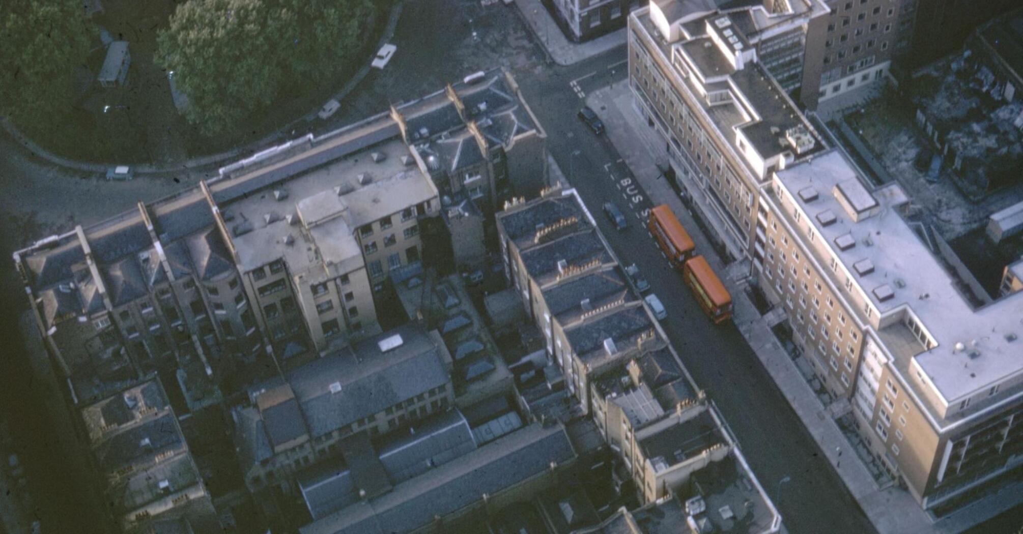 Aerial view of a London street with buses and buildings