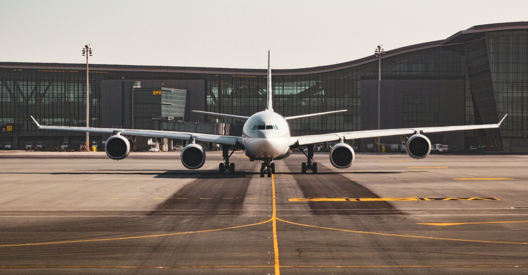 white airplane at the airports tarmac