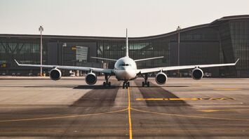 white airplane at the airports tarmac