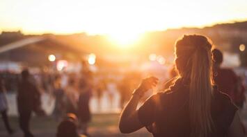 A person enjoying a sunset at a festival
