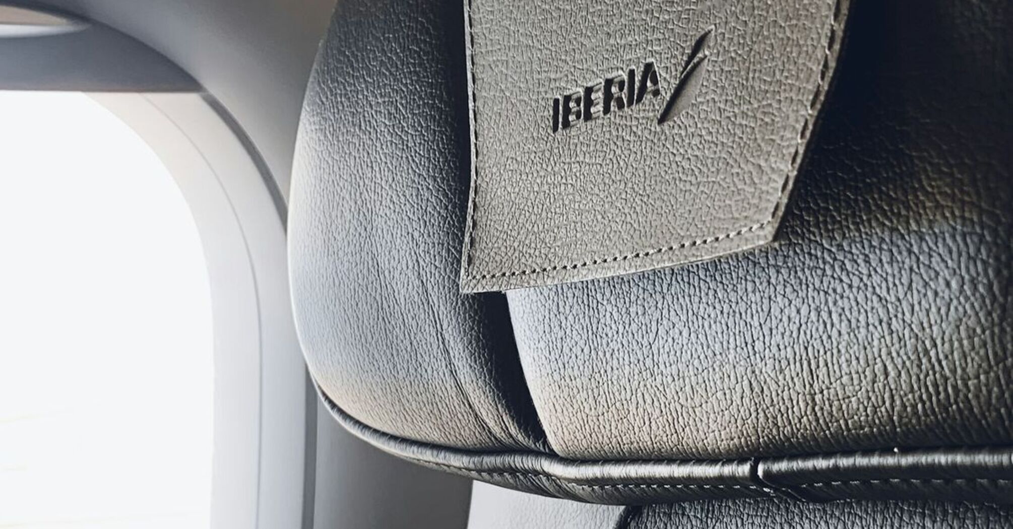 Iberia airplane seat with logo