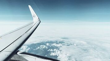 Lufthansa airplane wing and engine in flight