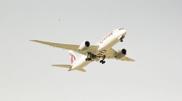 Qatar Airways plane in flight