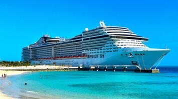 Cruise ship MSC moored on a white sandy beach