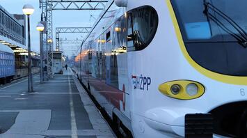 Modern train at a railway station with lighting