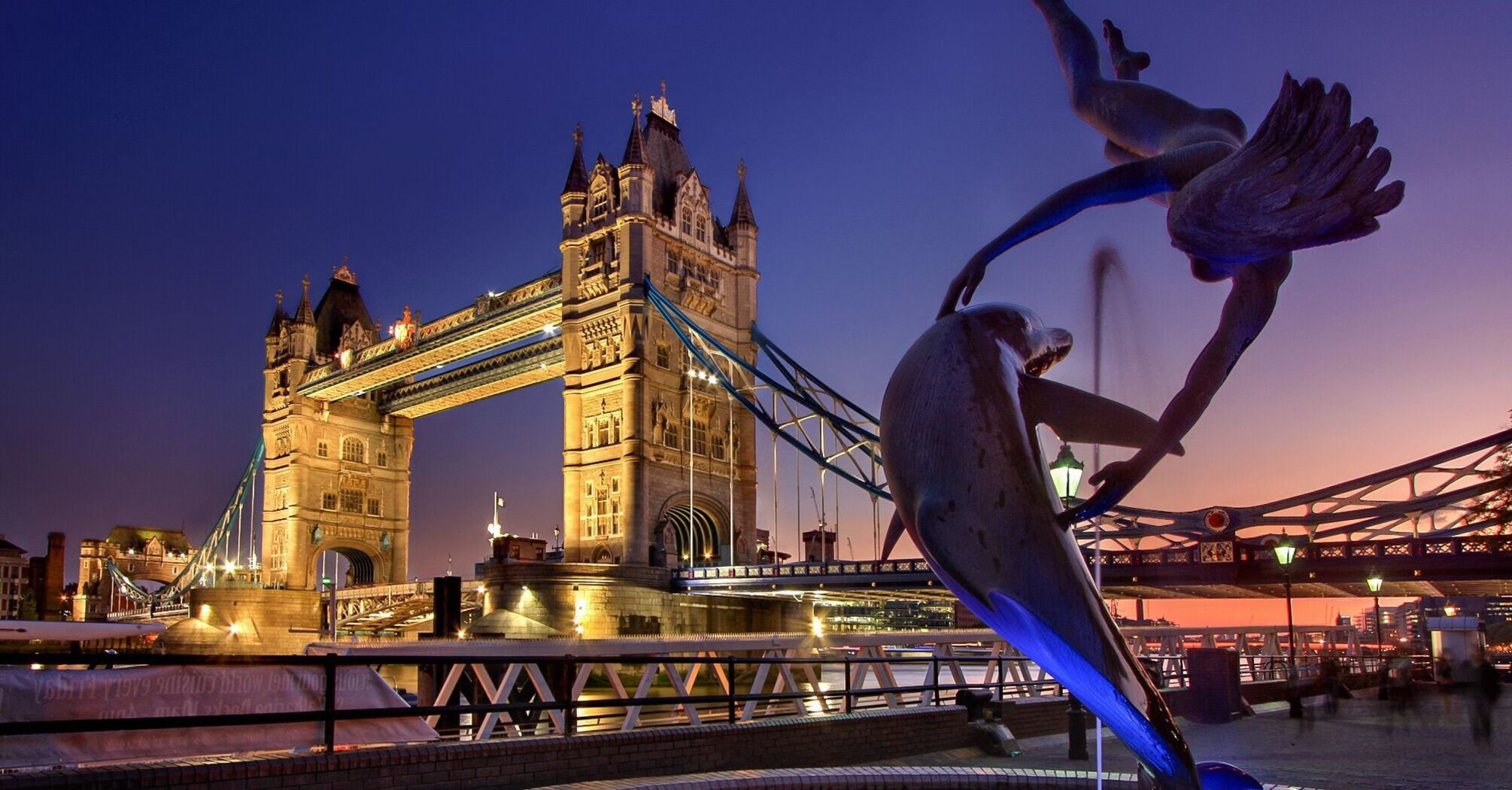 Tower Bridge and the Dolphin Fountain at dusk