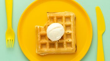 food photography of waffles with vanilla ice cream on top