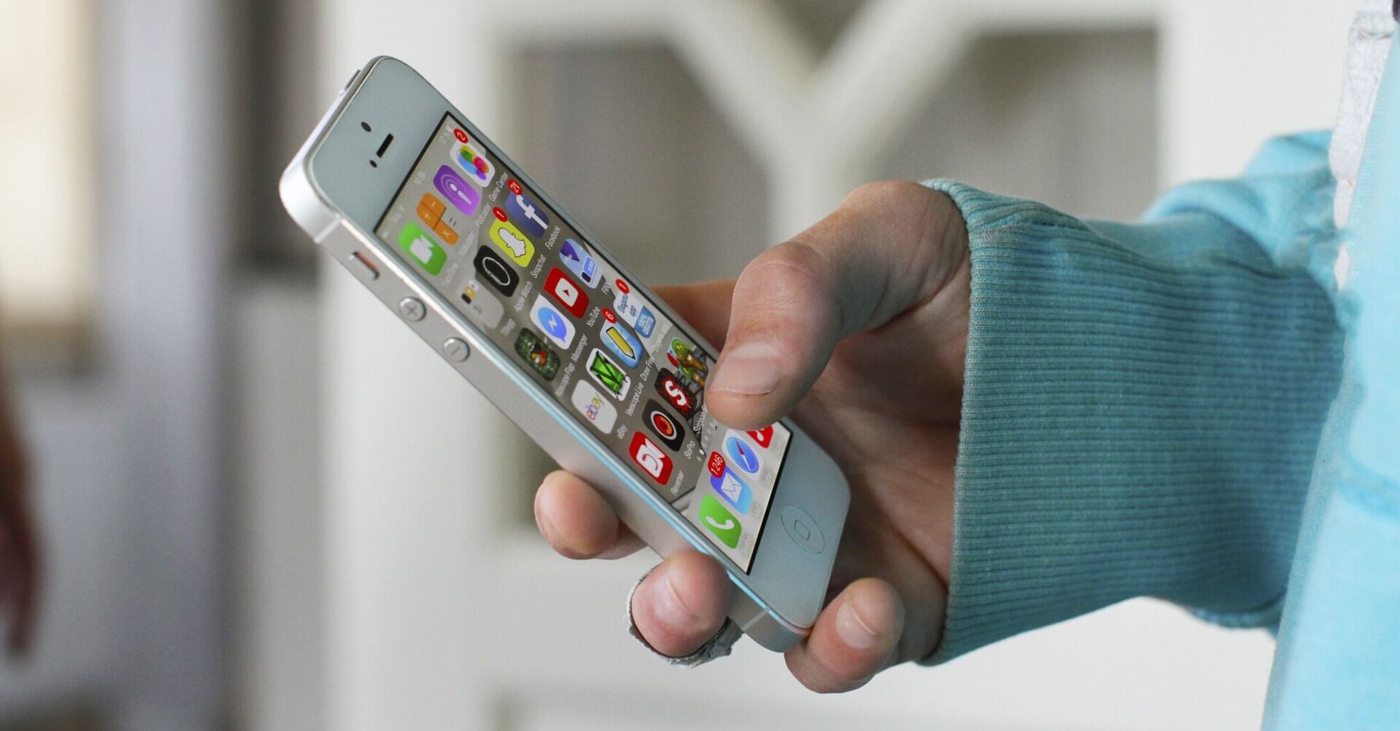 Person using a smartphone to check travel updates