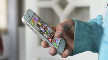 Person using a smartphone to check travel updates