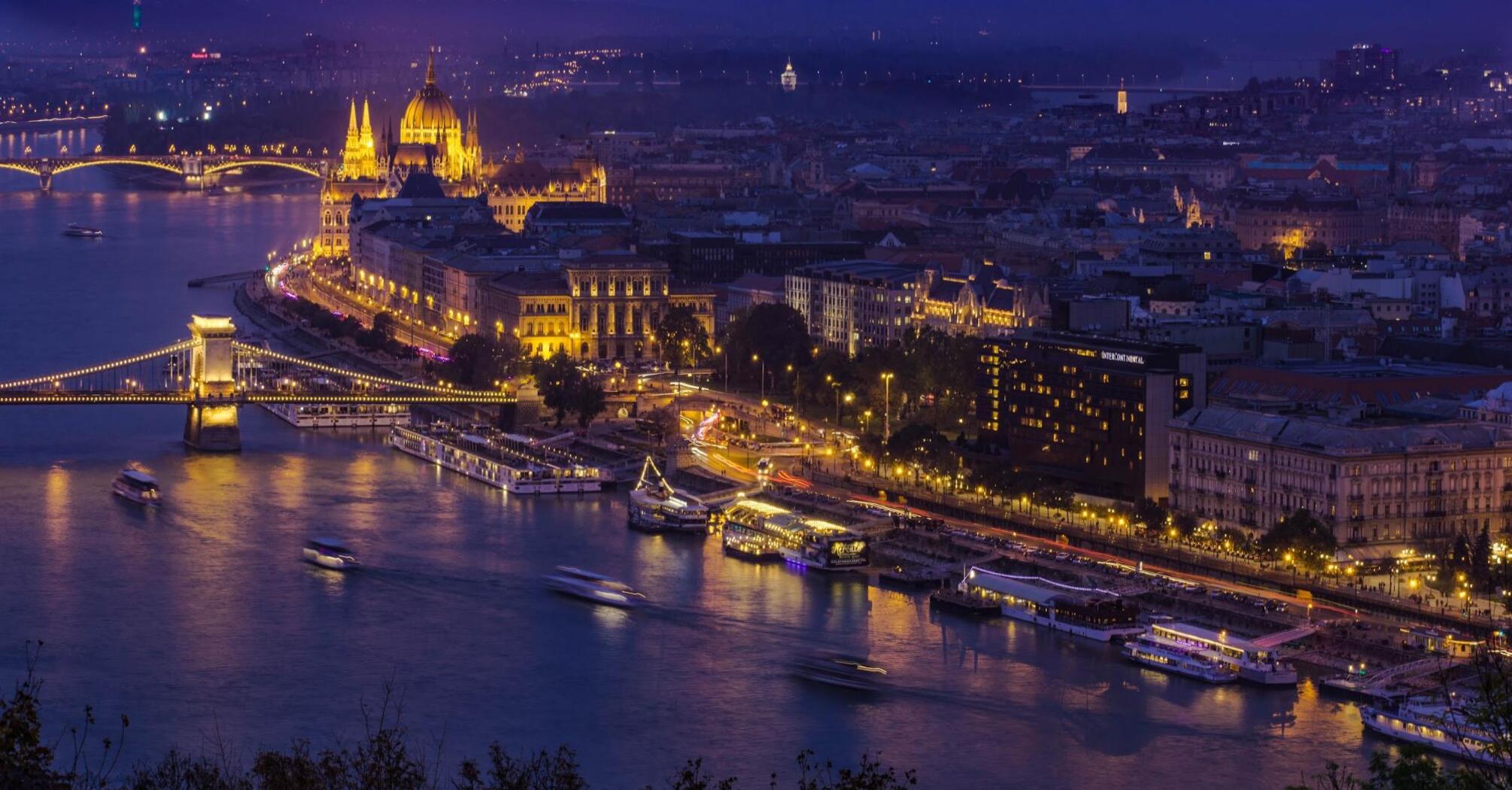 Night view of illuminated Parliament in Budapest and the Danube River