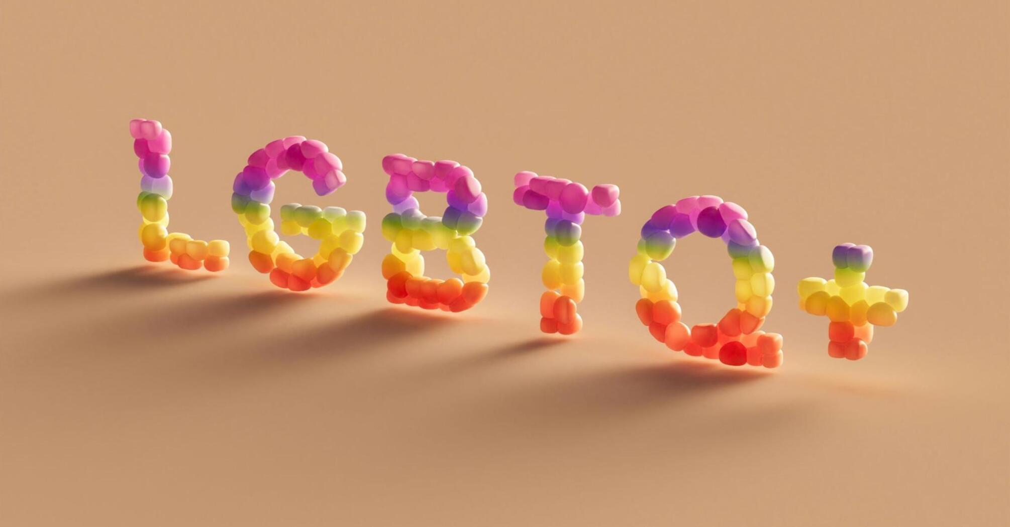 Bright inscription "LGBTQ+" made of multi-colored balls on a beige background