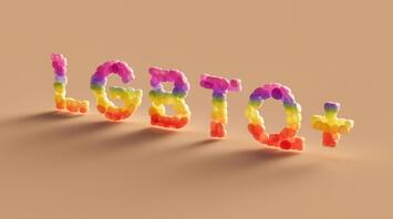 Bright inscription "LGBTQ+" made of multi-colored balls on a beige background