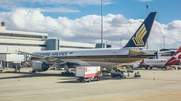 a large jetliner sitting on top of an airport tarmac