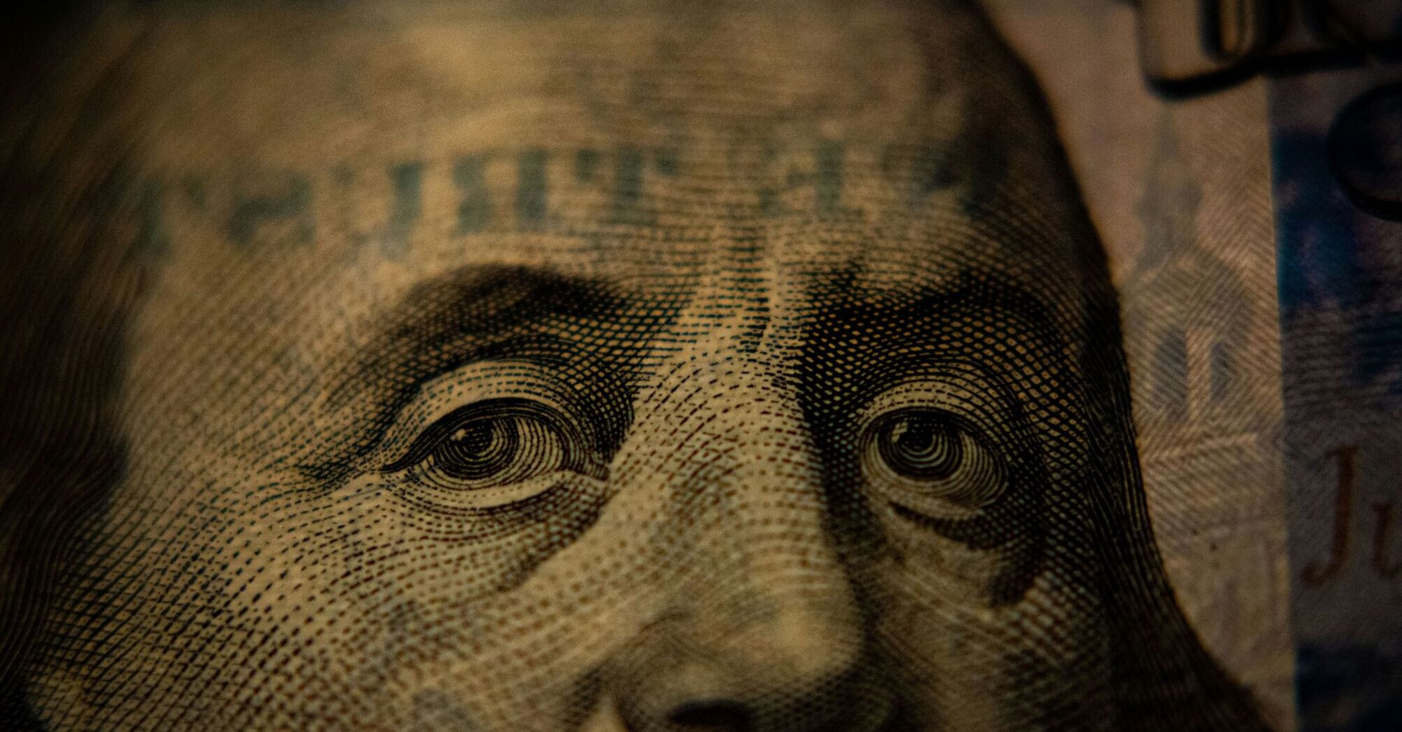 A closeup of a US hundred dollar bill (Benjamin Franklin side)