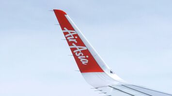 AirAsia airplane wing with logo