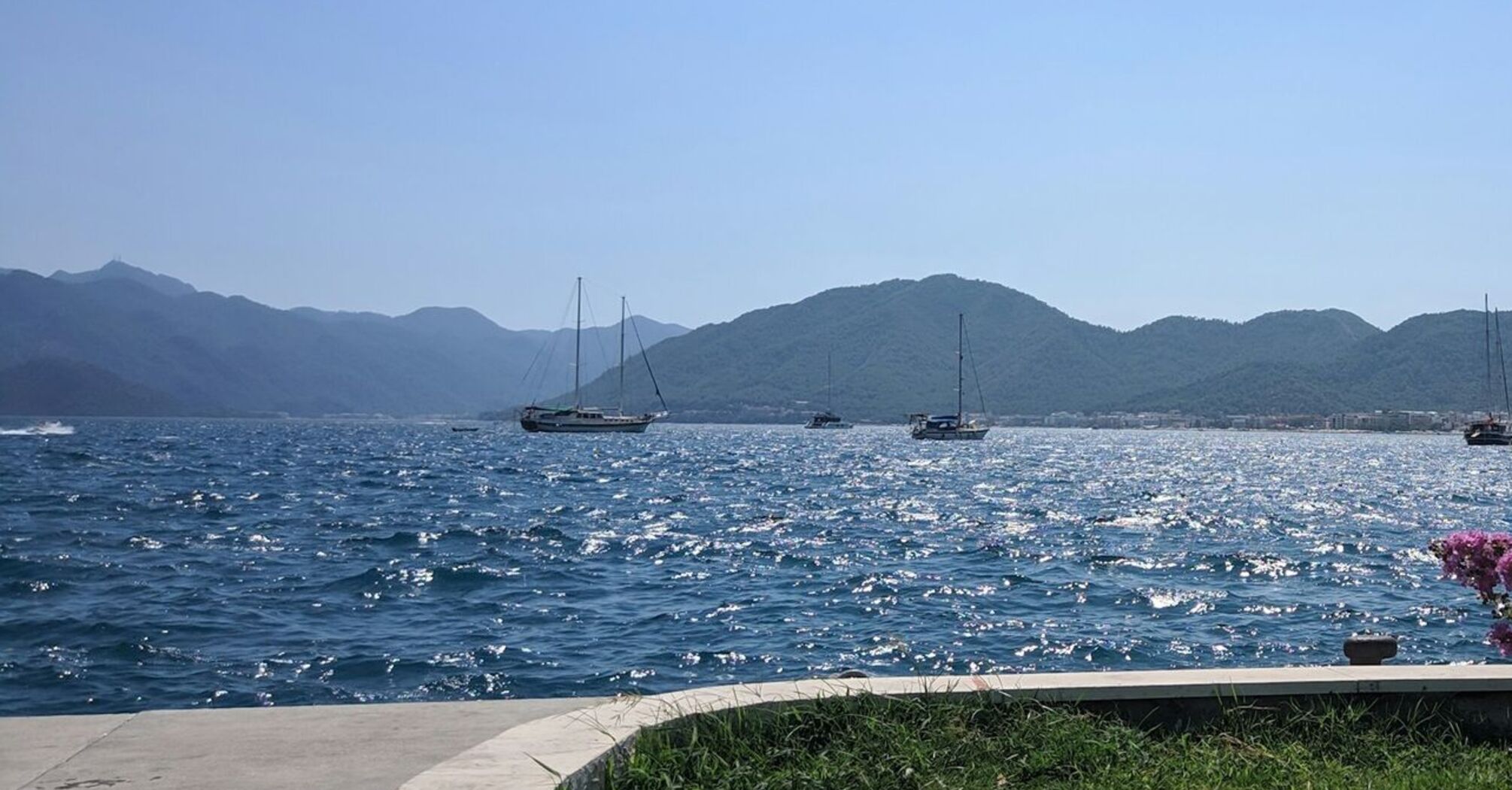 Boats on a calm sea with mountainous background in Marmaris, Turkey