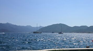 Boats on a calm sea with mountainous background in Marmaris, Turkey