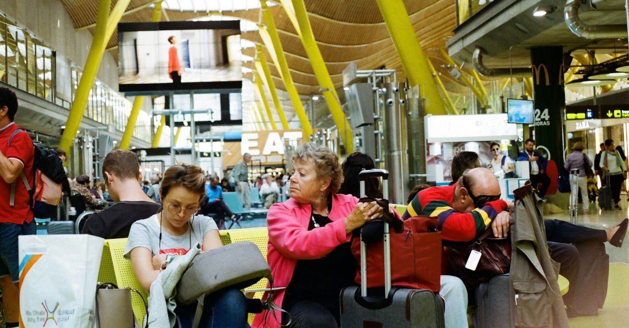 Passengers waiting at the airport after flight cancellations