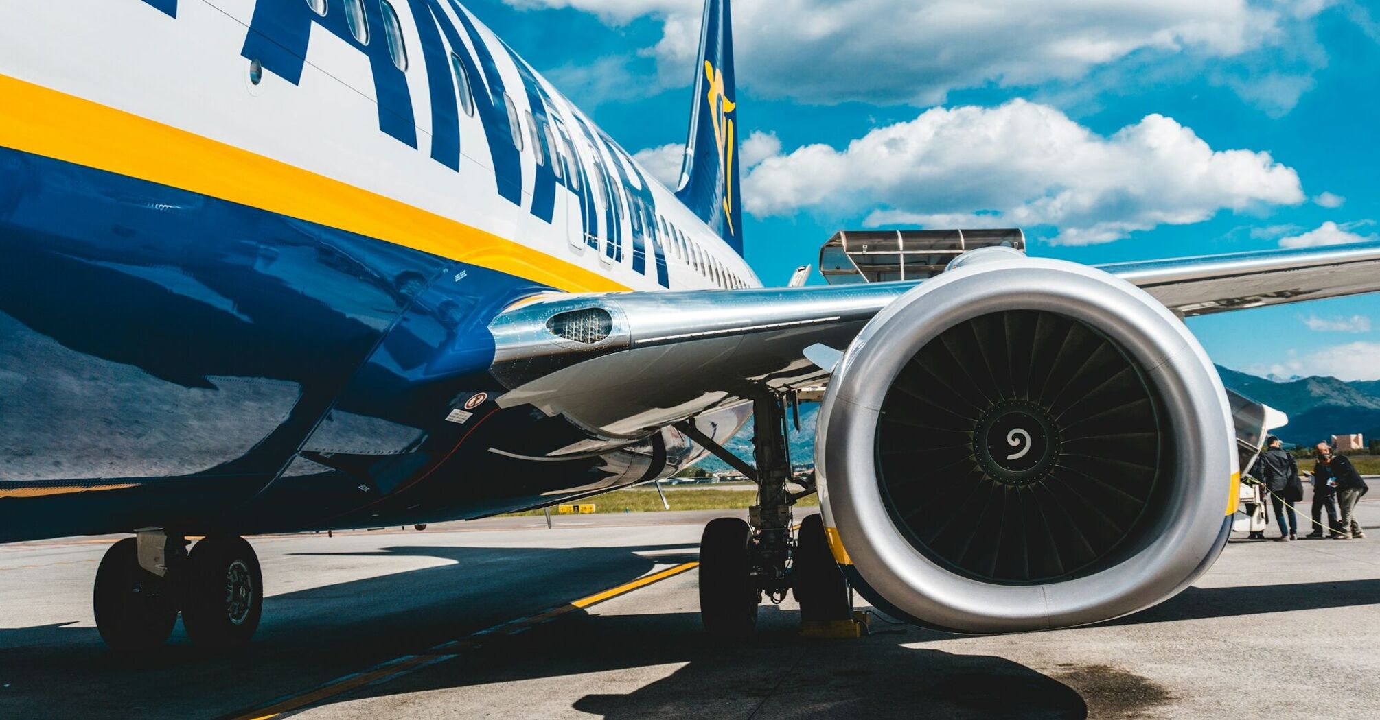 Ryanair aircraft parked on the tarmac with visible engine