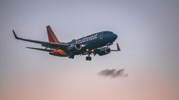 Southwest Airlines Boeing 737 landing at sunset