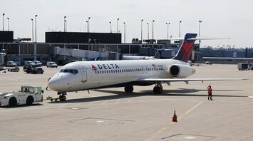 Delta Air Lines plane at airport gate