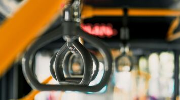 Close-up of handrails inside a public bus