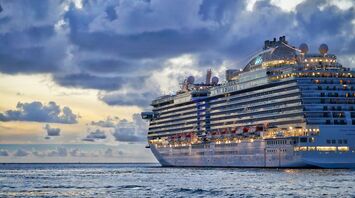Cruise ship sailing under cloudy skies