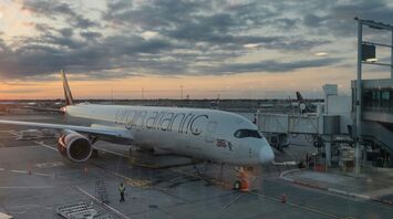 A Virgin Atlantic Airbus at John F. Kennedy Airport during sunrise
