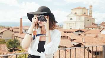 Travel influencer taking a photo in a scenic location