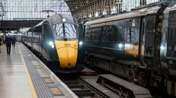 A modern Great Western Railway (GWR) train is stationed at a platform