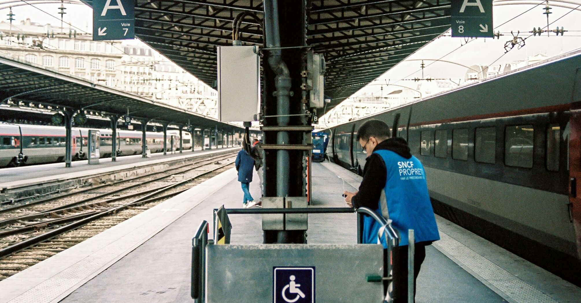 Platform at a French railway station with an SNCF employee