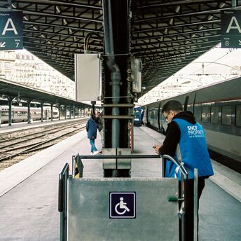 Platform at a French railway station with an SNCF employee