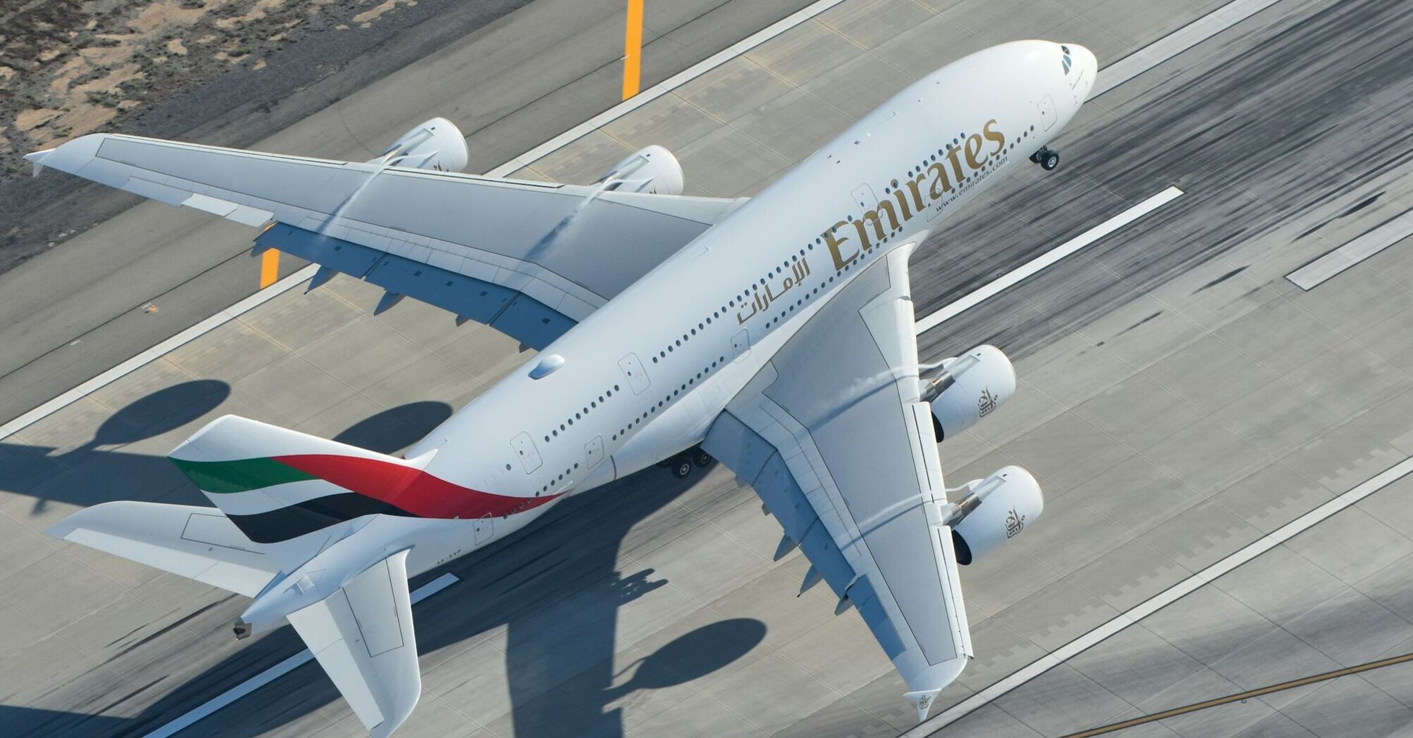 Emirates plane taking off from runway